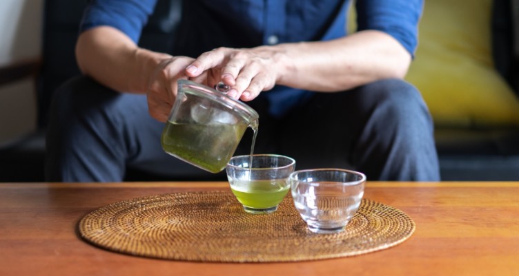 Man brewing green tean for prostate health