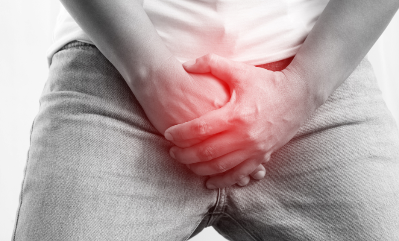 man experiencing pain after partial penile inflation