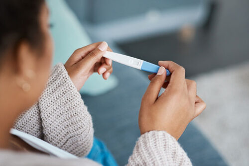 woman holding a test strip