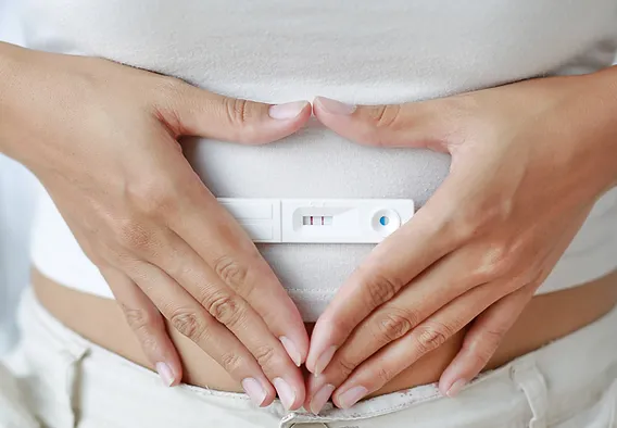 Lady using an ovulation strip to test for pregnancy