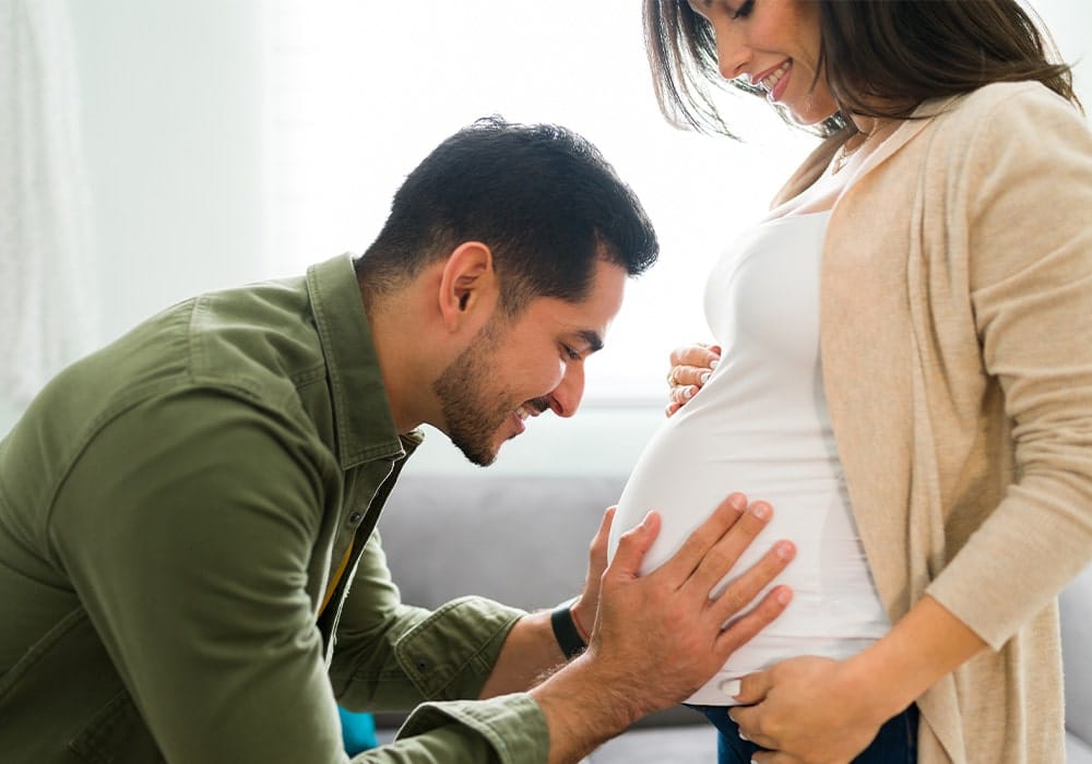 Husband and pregnant wife after using herbs for male fertility