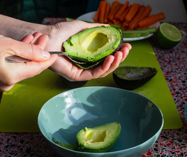 man taking avocado for health performance