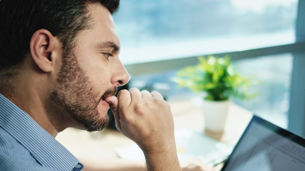 young man stressed over sexual performance