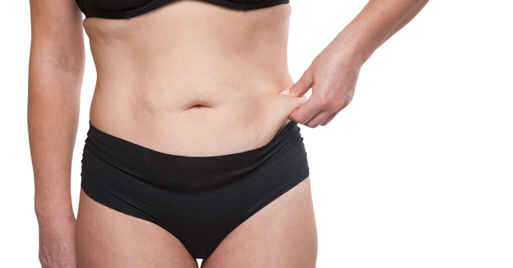 Wearing a swimsuit that is too tight can cause discomfort, especially around the abdomen.