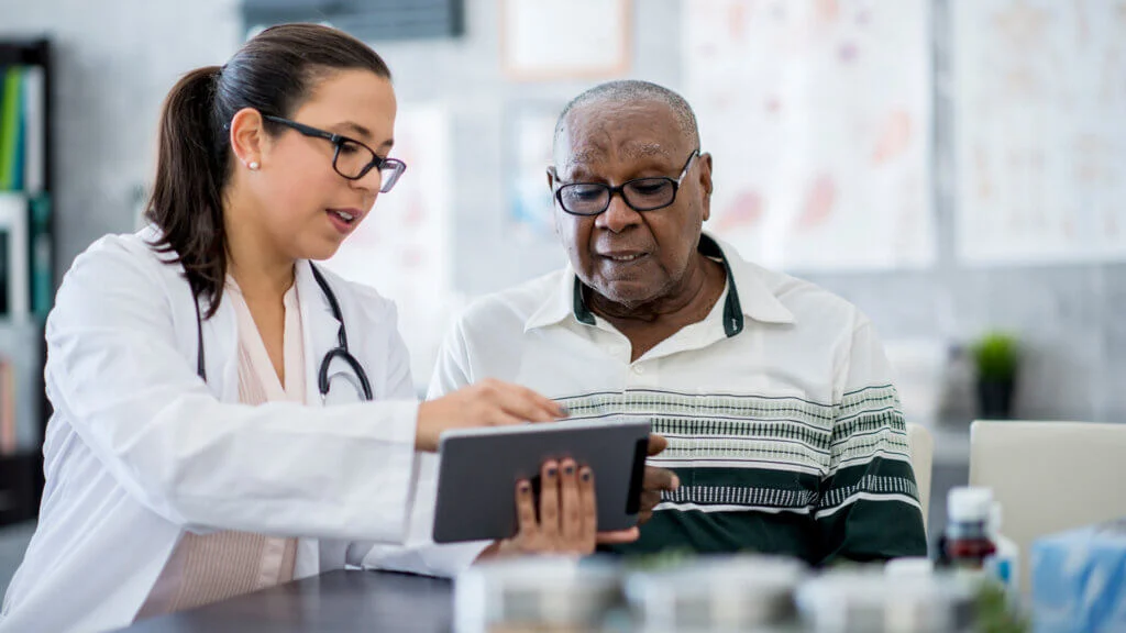 man consulting a doctor over hormonal imbalance