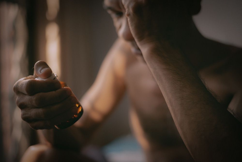man holding an Erectile dysfunction pills