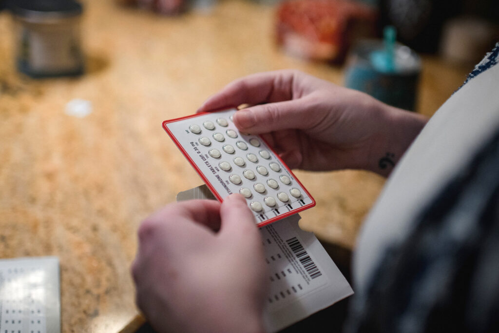 lady trying a birth control pill