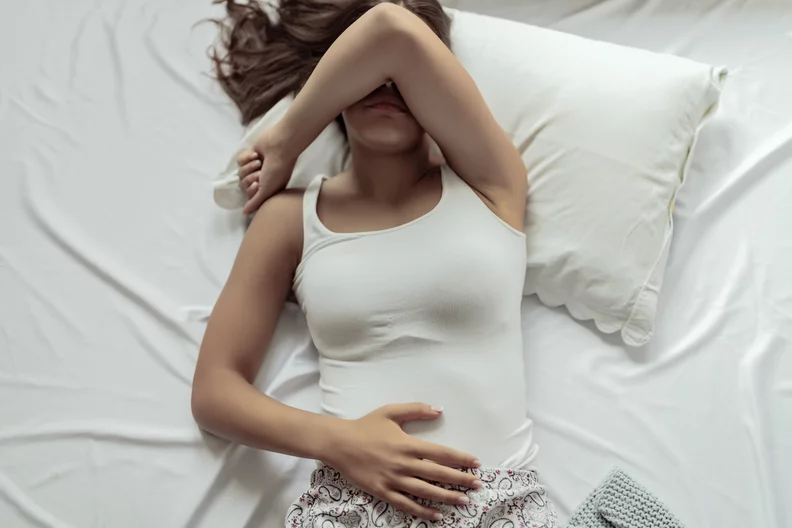 woman in pain due to dislodged IUD