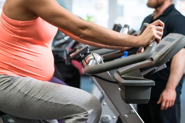 postpartum mom wearing nice set of clothes for post partum exercises
