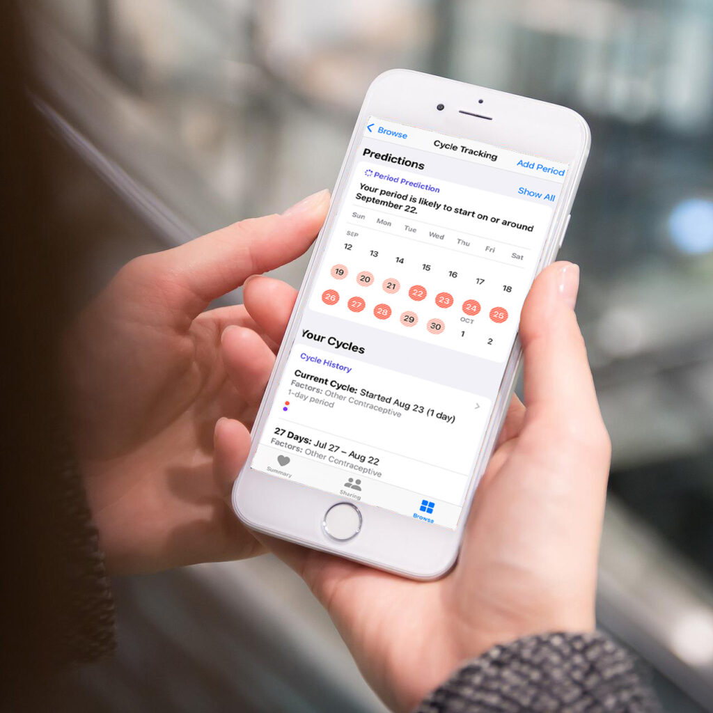 woman using a period tracking app