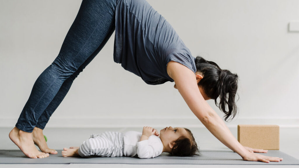 mother engaging child in postpartum exercises