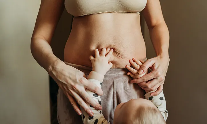 a postpartum mother and baby