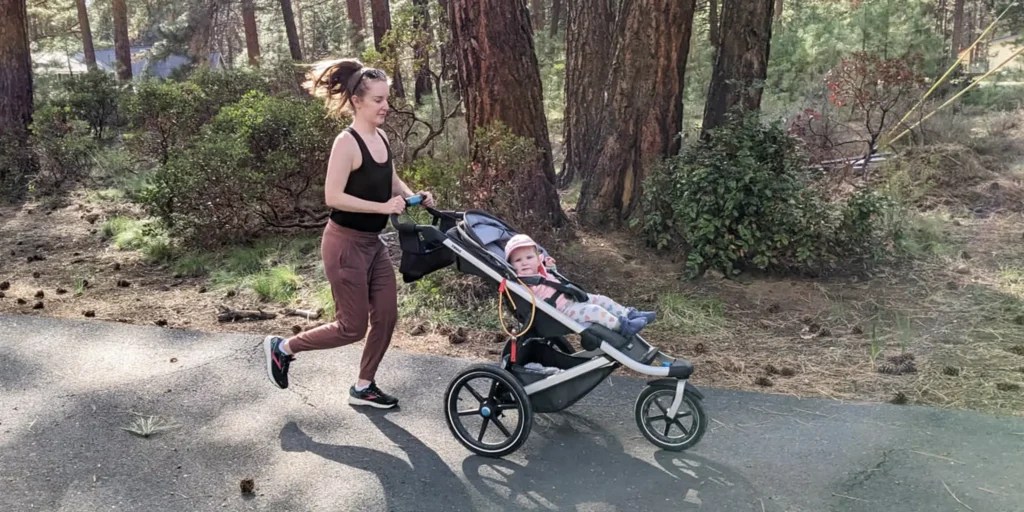 mom going for a postpartum walk with child