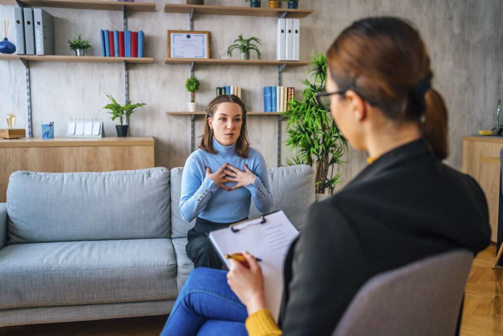 Young woman talking to a therapist