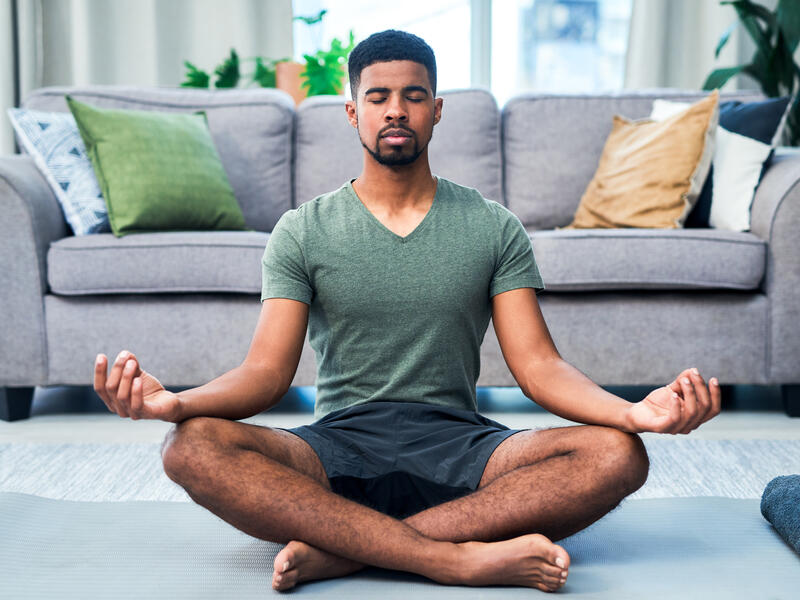 young man practicing yoga to relief depression