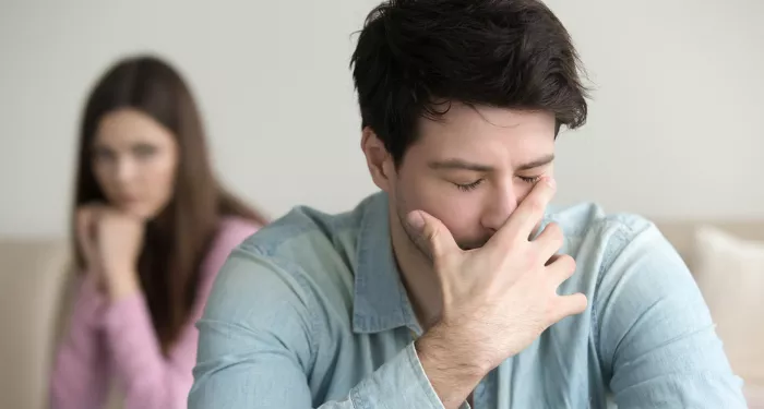 young man sad over his chronic sexual condition
