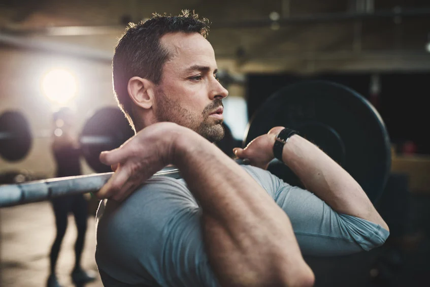 A man working out in order to boost his testosterone level