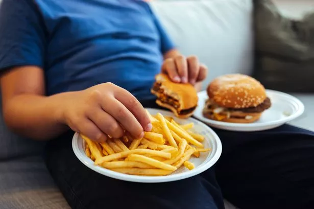 man eating processed foods