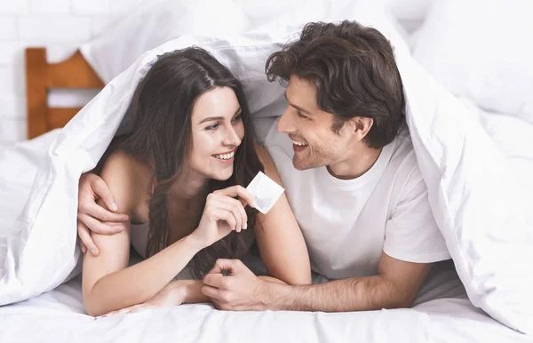 couples practicing safe sex 