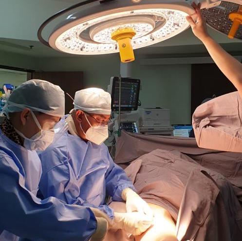 doctors trying to perform surgery