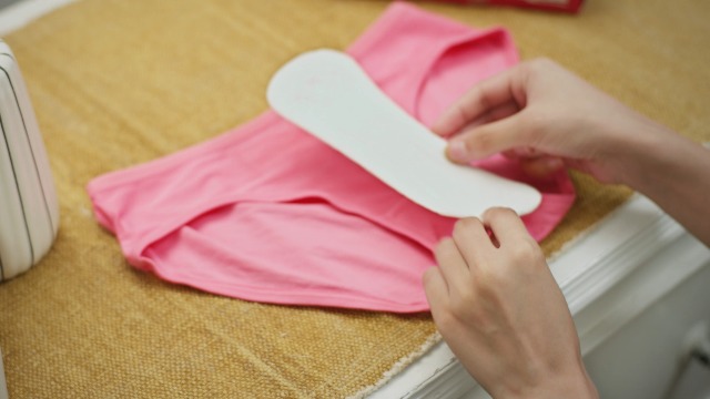 placing panty liners on panties