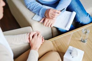 woman talking with an unlicensed practitioner