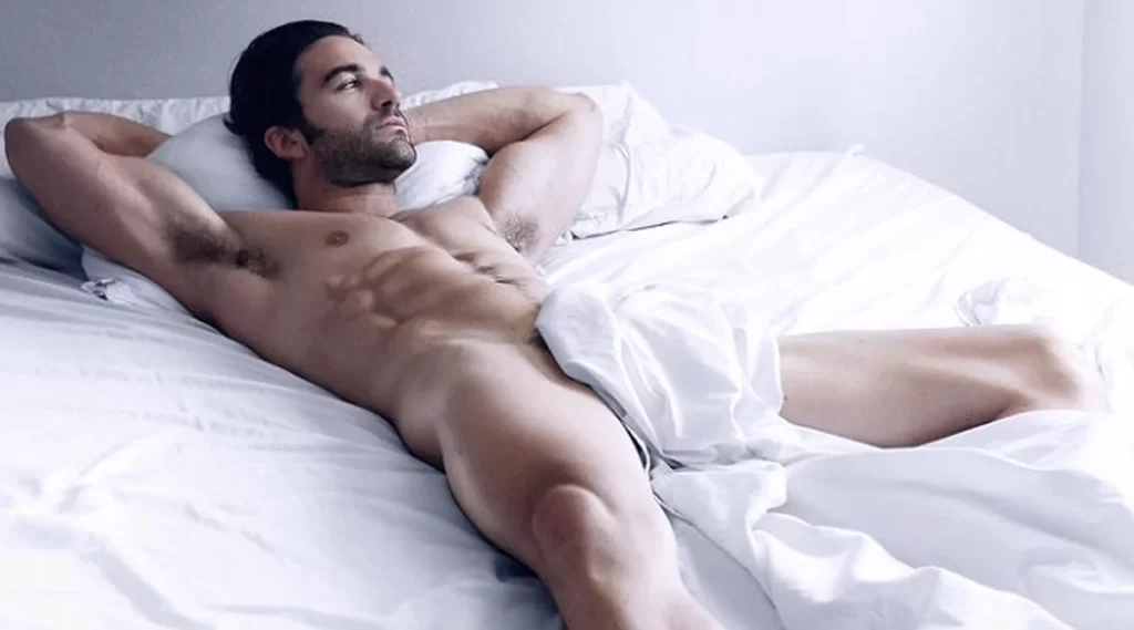 man lying don comfortably half naked