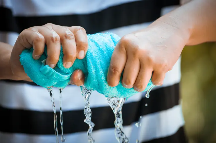 squeezing a towel