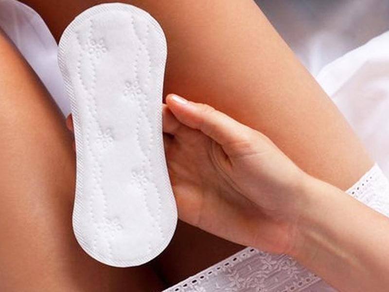 woman holding a panty liner 