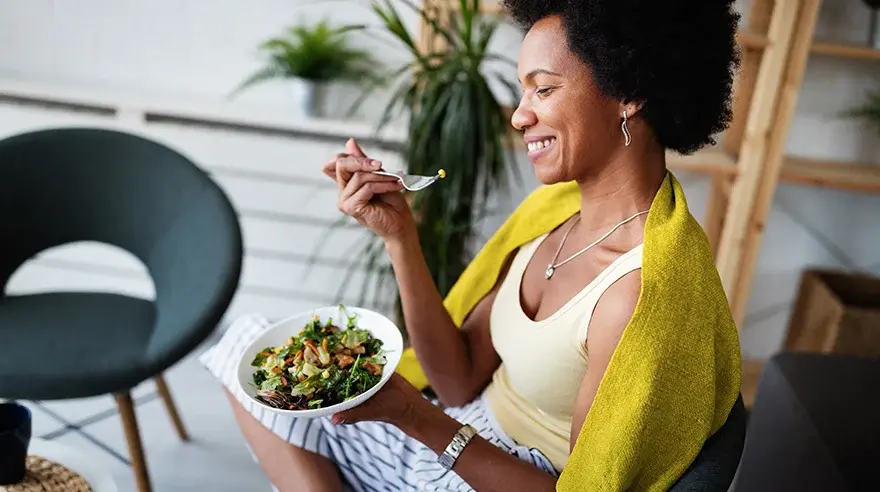young woman eating healthy food 