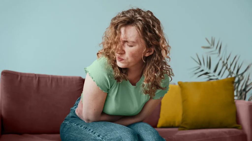 lady experiencing ovulation pain