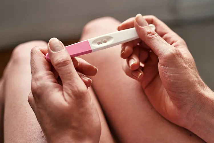 young woman testing for pregnancy